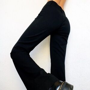 "vertigo pants" black, wide-leg pants with a decorative waistband.